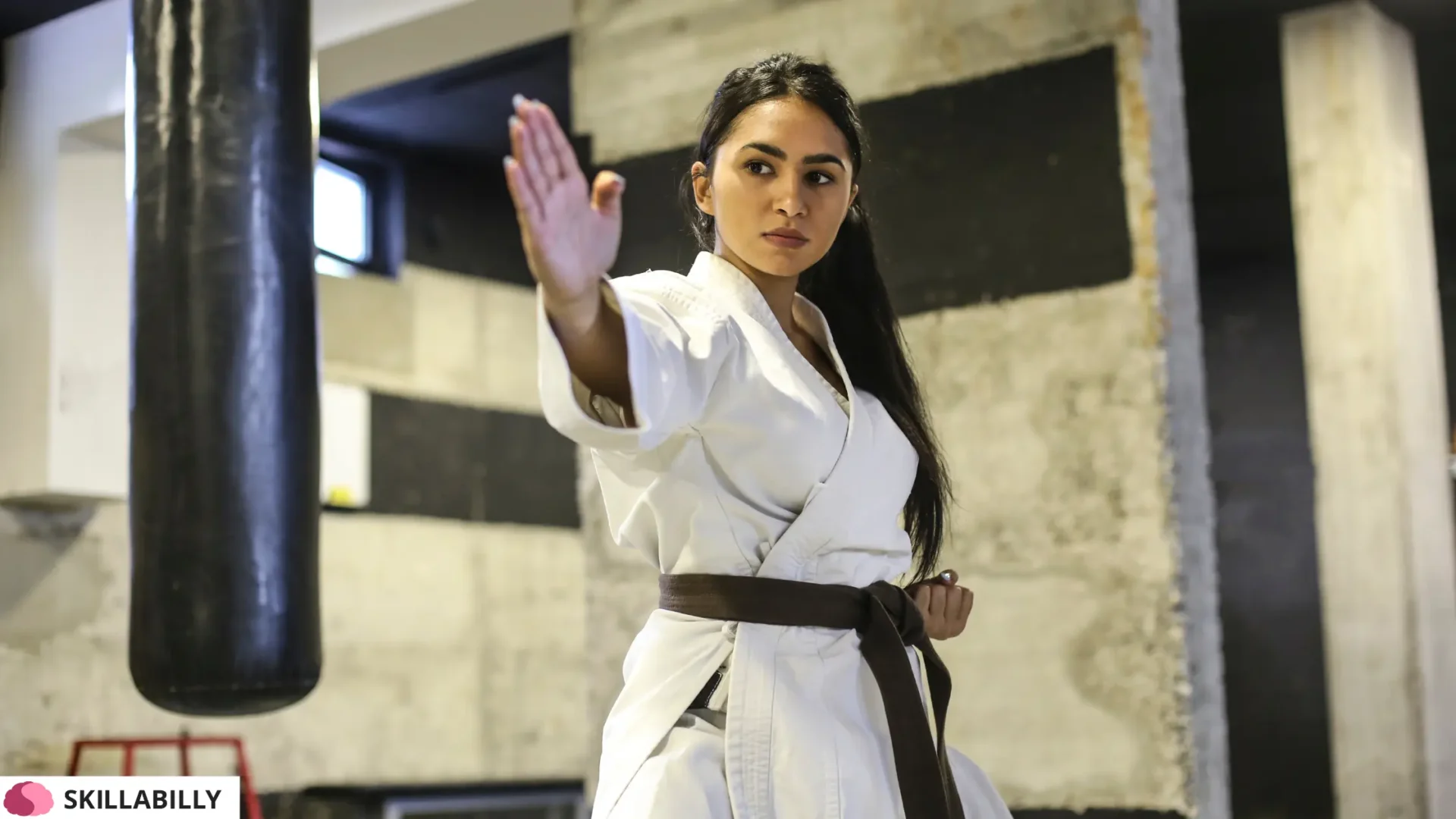 A women practicing martial arts at a local gym